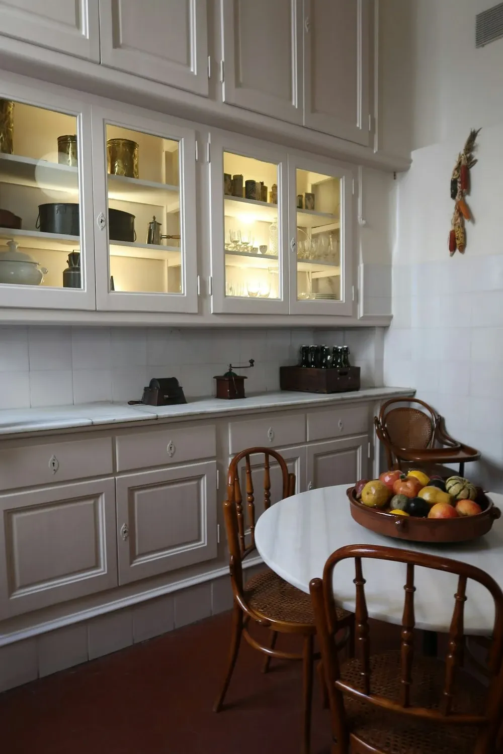 Farmhouse coffee bar with glass-front kitchen cabinets